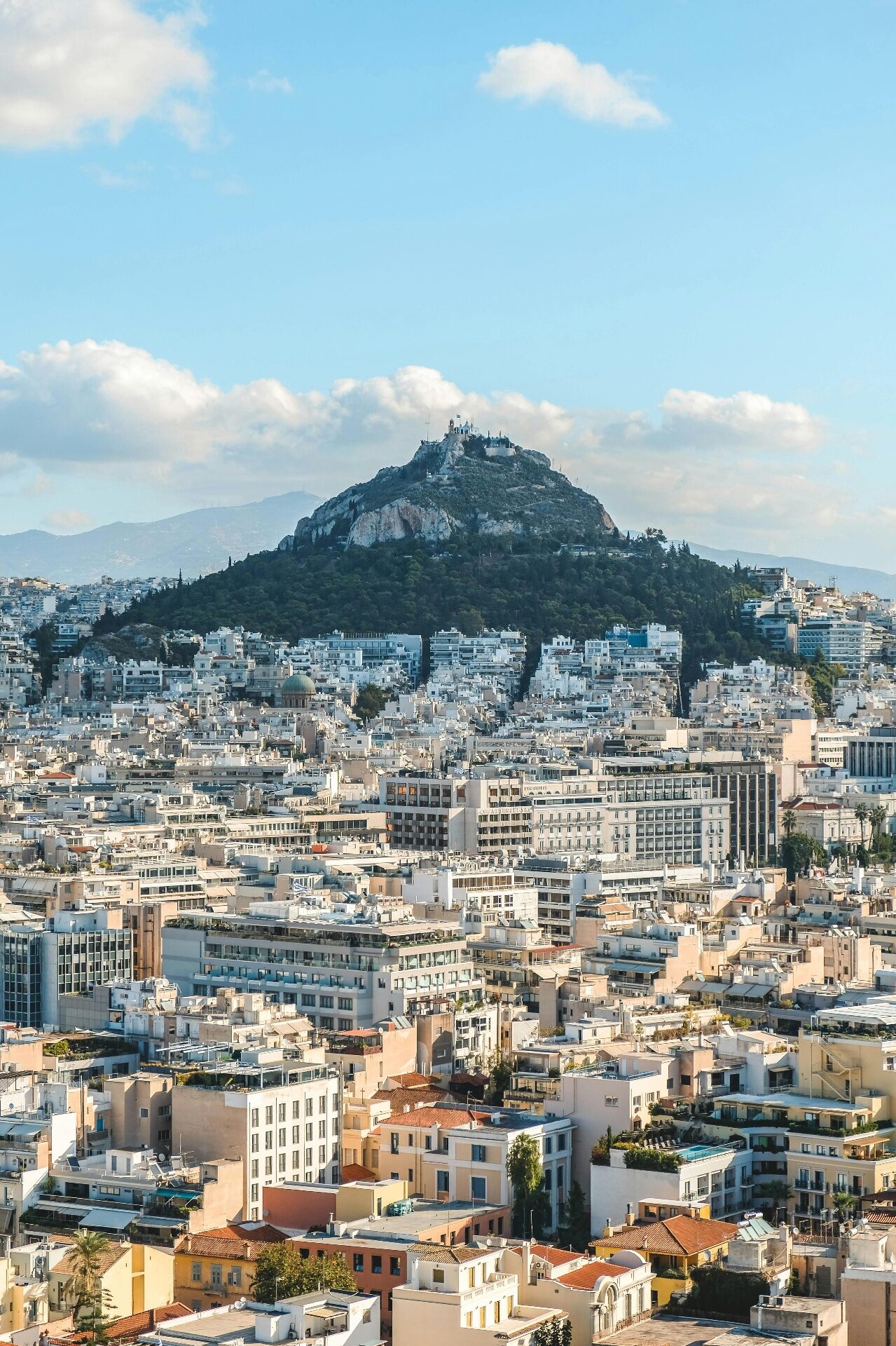 Athens city skyline with mountains in the background